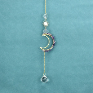 Detail of moon suncatcher with amethyst stones and sparkling crystal ball pendant