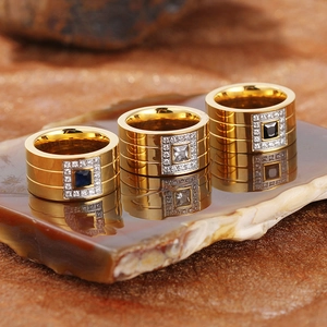 Polished gold stainless steel wide rings set with blue, clear and black zircon stones
