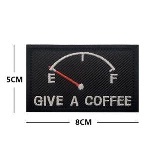 Detail view of coffee fuel gauge embroidered patch measuring 8cm by 5cm with dimensions