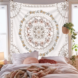 Detailed view of a beige bohemian mandala tapestry hanging as elegant bedroom wall decor
