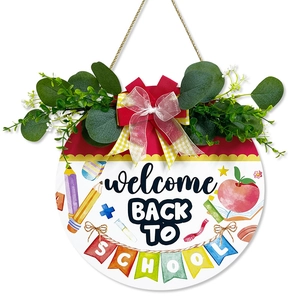 Welcome Back to School round wooden door sign with eucalyptus leaves and colorful bows