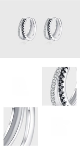 Detail of 925 sterling silver hoop earrings with hand-set 5A black and white zircons