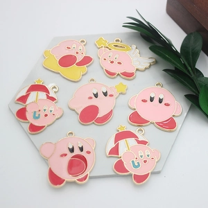 Macro shot of seven pink enamel cartoon pendants with golden metal edges for DIY crafts