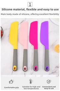 Set of four colorful silicone spatulas on marble surface for baking and mixing cakes