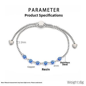 Detail of 2mm silver box chain bracelet with 4mm blue evil eye charms and heart dangles