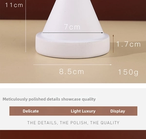 Macro detail of white conical resin jewelry stand showing dimensions 11cm height and 150g weight