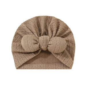 Knitted infant turban hat with large bow in beige, soft crochet baby beanie headwear