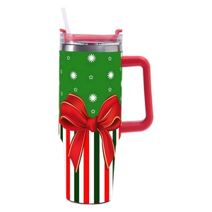Christmas 40oz stainless steel tumbler with handle, straw, and festive bow pattern