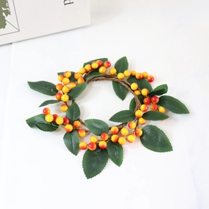 Artificial Christmas berry candle ring with orange gradient berries and green leaves