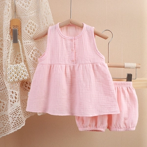 Pink muslin cotton toddler pajama set featuring ruffled sleeveless top and bloomer shorts