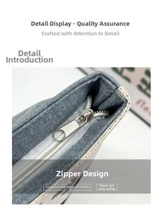 Macro shot of smooth metal zipper and gray felt texture on large capacity handbag