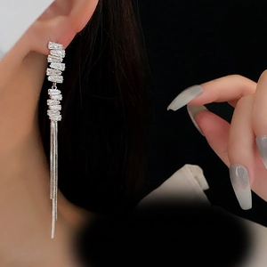 Elegant silver tassel earrings with sparkling rhinestones and long metallic chains