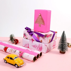 Pink gift wrapping paper rolls with festive patterns for Christmas and holiday presents