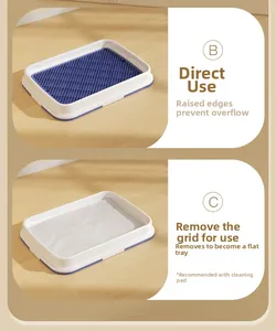 Detail der Hundetoilette mit erhöhtem Rand und blauem Gitter gegen Urinspritzer