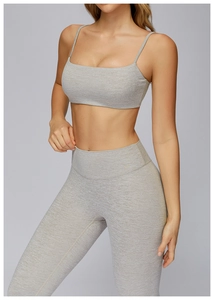 Close-up of heather grey yoga set featuring racerback sports bra and high-waist leggings