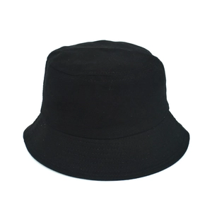 Close-up of black cotton bucket hat showing fine stitching and minimalist sun protection design