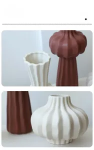 Detailed macro view of matte textured vertical stripes on modern ceramic vases