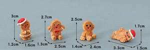 Detailed macro view showing exact dimensions of four miniature resin gingerbread figures