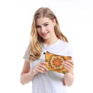 Women's sunflower pattern cosmetic bag with celestial design shown by smiling model