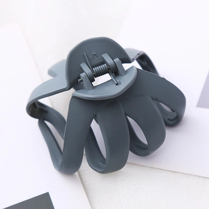 Macro view of a large 8cm matte dark blue octopus hair claw clip with nonslip metal spring