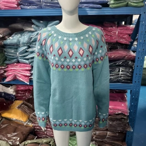 Detail of light blue crewneck sweater with vintage geometric argyle knit pattern