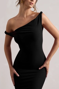 Detail showing the asymmetrical off-shoulder neckline and slim fit of the black dress