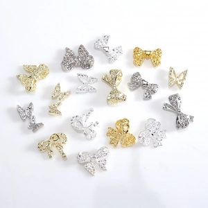 Bowknot and butterfly metal nail art charms with sparkling rhinestones in gold and silver