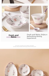 Detail of purple floral ceramic dinnerware set with hand-painted patterns and vintage borders