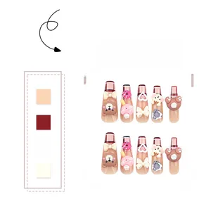 Detail of 3D bear press-on nails with plaid patterns, bows, and 3D resin charms