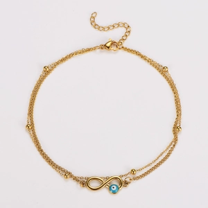 Golden double-layer anklet with infinity symbol and blue evil eye bead detail