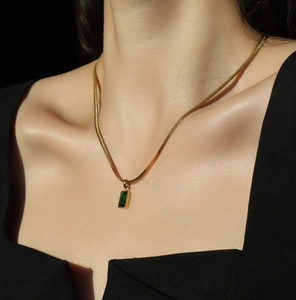 Elegant 18K gold plated snake chain necklace with emerald green rectangular pendant