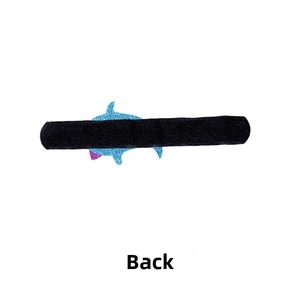 Detail view of the blue glitter shark back and black velvet strap on a kids slap bracelet