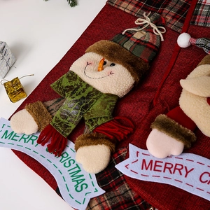 Detail of red linen Christmas stocking with 3D snowman applique and Merry Christmas tag