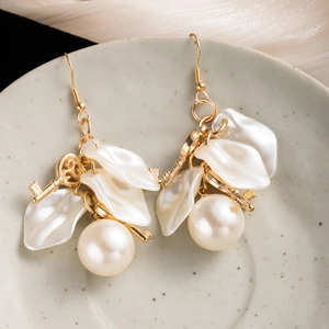 French vintage pearl drop earrings with white petals and golden key pendants