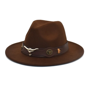 Detail of western brown felt hat featuring metal longhorn bull ornament on leather band