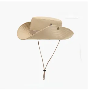 Detail of beige outdoor sun hat showing breathable metal vents and adjustable wind cord