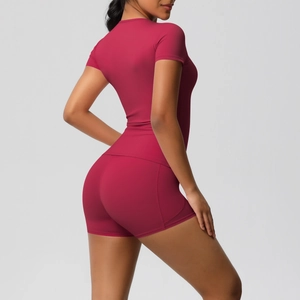 Detail view of dark red breathable yoga set including slim fit t-shirt and high waist shorts