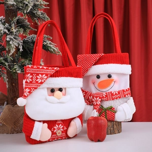 Christmas knit gift bags with Santa and snowman designs for holiday treats and candy