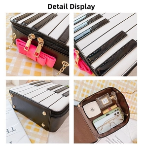 Detail view of piano key handbag with pink bow, golden zipper and chain strap