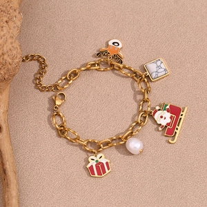 Detail view of 18K gold-plated Christmas bracelet with Santa and reindeer charms