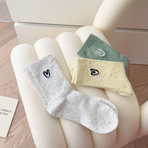 Three-pack heart embroidered crew socks with colorful polka dots in pastel colors