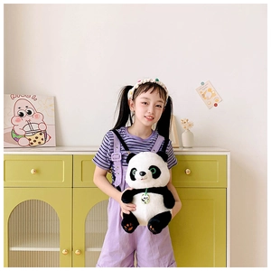 Detailed view of plush giant panda backpack featuring soft faux fur and adjustable straps