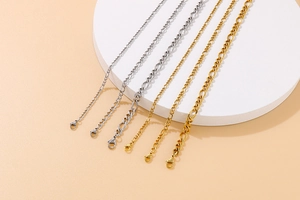 Detailed shot of assorted gold and silver titanium steel link chains with lobster clasps