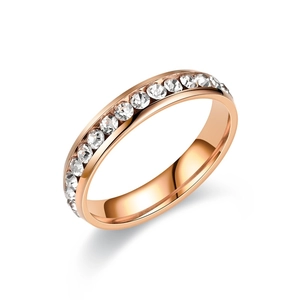 Polished rose gold titanium ring with circular cubic zirconia in channel setting