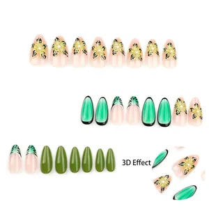 Almond press-on nails with 3D tropical flowers and green cat-eye patterns