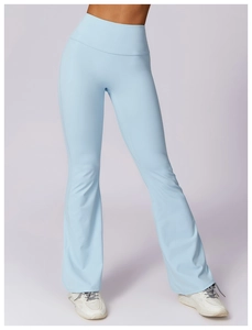 Macro detail of high-waisted flared yoga pants in light blue showing the split hem design