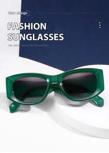 Detailed view of dark green square sunglasses with translucent frames on a white pedestal
