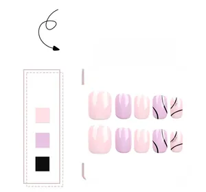 Close-up of pink and purple short square-oval press-on nails with silver glitter and black lines