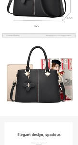 Detailed view of black handbag dimensions showing 30cm width and large A4 capacity