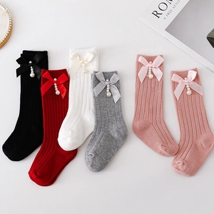 Spanish style ribbed knit baby knee high socks with bow and pearl charms in five colors